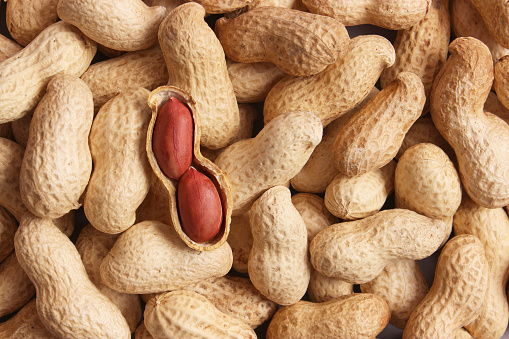 Peanuts on a light background close up. High quality photo