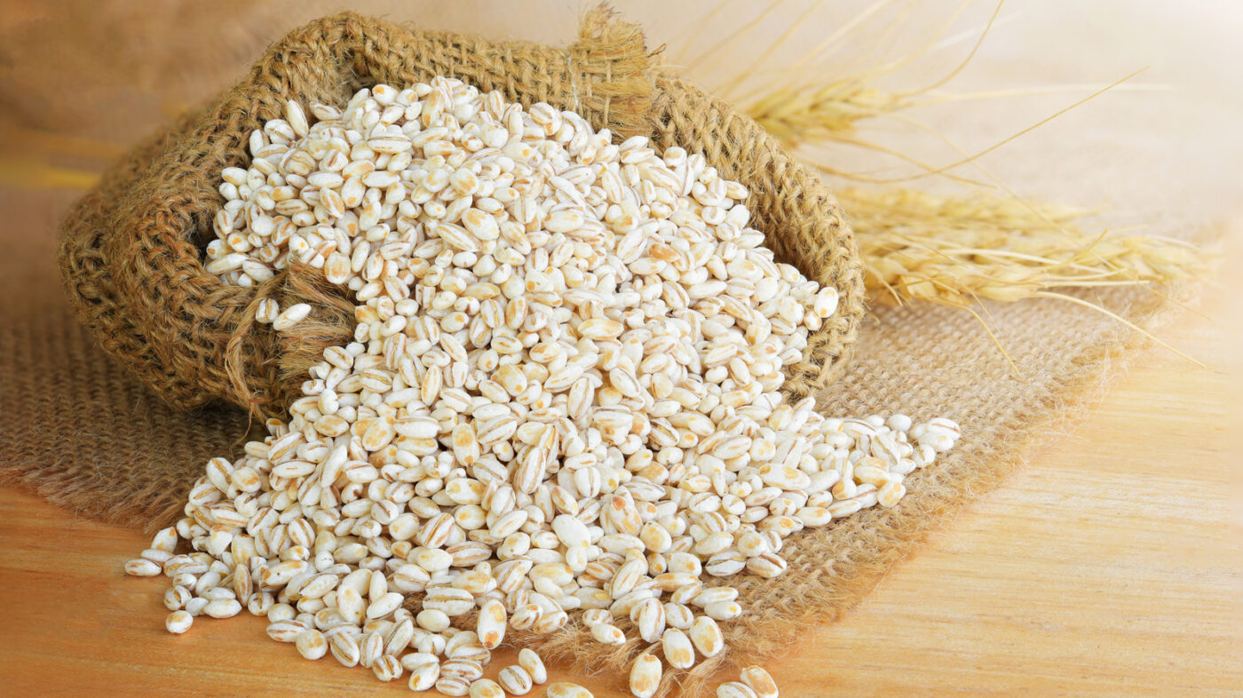 Barley,Grain,In,Wooden,Background,Barley,Grain,Is,Raw,Material